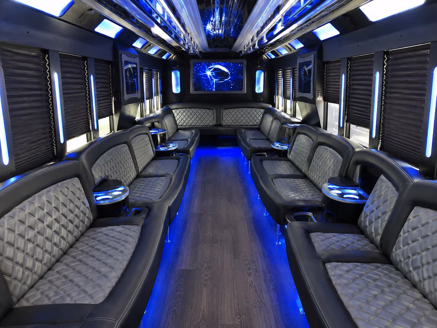 Friends laughing during a party bus celebration in Santa Ana